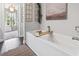 Serene bathroom featuring a soaking tub with a wooden caddy and natural light at 1048 Meadowoods Dr., Murrells Inlet, SC 29576