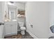 Well-lit half bathroom featuring stylish vanity with modern fixtures and decorative touches at 1048 Meadowoods Dr., Murrells Inlet, SC 29576