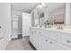 Clean bathroom featuring a dual sink vanity, framed mirror, and updated finishes at 1048 Meadowoods Dr., Murrells Inlet, SC 29576