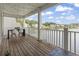 Enjoy the scenic view from this covered patio overlooking the tranquil lake, perfect for outdoor living at 1048 Meadowoods Dr., Murrells Inlet, SC 29576
