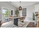 Dining area featuring a large window, modern lighting and outdoor access to the porch at 1048 Meadowoods Dr., Murrells Inlet, SC 29576