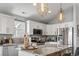 Bright kitchen featuring stainless steel appliances, granite countertops, and white cabinetry at 1048 Meadowoods Dr., Murrells Inlet, SC 29576