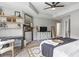 Inviting main bedroom boasts a large bed, vintage decor, and a cozy sitting area at 1048 Meadowoods Dr., Murrells Inlet, SC 29576