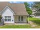 Charming backyard with a covered patio and double french doors leading inside, providing seamless indoor-outdoor living at 1057 Stanton Pl. # 1057, Myrtle Beach, SC 29579