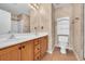 The bathroom boasts a double sink vanity, a toilet, and a shower with neutral colors at 1057 Stanton Pl. # 1057, Myrtle Beach, SC 29579