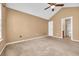 Bedroom with carpet, ceiling fan, attached bath, and natural lighting at 1057 Stanton Pl. # 1057, Myrtle Beach, SC 29579
