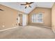 A neutral bedroom with carpet, a fan, and a window offers a calm and inviting atmosphere at 1057 Stanton Pl. # 1057, Myrtle Beach, SC 29579