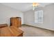 Bright bedroom with a large window and classic wood furniture pieces at 1057 Stanton Pl. # 1057, Myrtle Beach, SC 29579