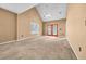 Neutral living room featuring vaulted ceilings, windows, and carpet at 1057 Stanton Pl. # 1057, Myrtle Beach, SC 29579