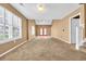 Spacious carpeted living room with natural light and french doors at 1057 Stanton Pl. # 1057, Myrtle Beach, SC 29579