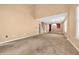 Large living room showcasing lots of natural light, high ceilings, and carpeted flooring at 1057 Stanton Pl. # 1057, Myrtle Beach, SC 29579