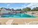 Inviting community swimming pool with ample lounge chairs and a well-maintained pool deck at 1057 Stanton Pl. # 1057, Myrtle Beach, SC 29579
