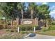 Welcoming entrance sign for Sawgrass East, framed by lush greenery and manicured landscaping at 1057 Stanton Pl. # 1057, Myrtle Beach, SC 29579