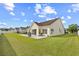 Well-manicured backyard with a patio, featuring a lush lawn, ideal for outdoor activities and gatherings at 107 Fox Den Dr., Murrells Inlet, SC 29576