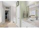 Bright bathroom features a double vanity, walk-in closet and a soaking tub with natural light at 107 Fox Den Dr., Murrells Inlet, SC 29576