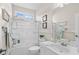 Bright bathroom with a tub-shower combo, framed mirror, and white vanity, offering a clean, functional space at 107 Fox Den Dr., Murrells Inlet, SC 29576