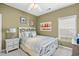 Cozy bedroom featuring a white wood bed frame and matching bedside table beneath a ceiling fan at 107 Fox Den Dr., Murrells Inlet, SC 29576