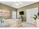Comfortable bedroom with a ceiling fan, TV, closet and windows offering natural light at 107 Fox Den Dr., Murrells Inlet, SC 29576