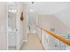 Upstairs hallway featuring a bathroom and railing overlooking the home's entryway at 107 Fox Den Dr., Murrells Inlet, SC 29576