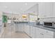 Efficient kitchen with updated appliances, bright lighting, and a seamless flow into the adjacent dining area at 107 Fox Den Dr., Murrells Inlet, SC 29576
