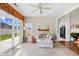 Bright sunroom featuring a chaise lounge, sliding glass doors, and neutral tones for a peaceful retreat at 107 Fox Den Dr., Murrells Inlet, SC 29576