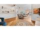 Bright living room with hardwood floors, comfortable seating, and open access to other living spaces at 107 Fox Den Dr., Murrells Inlet, SC 29576