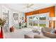 Comfortable living room with sliding glass doors leading to the patio, offering seamless indoor-outdoor living at 107 Fox Den Dr., Murrells Inlet, SC 29576