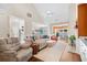 Open-concept living room featuring a vaulted ceiling, hardwood floors, and a spacious seating area at 107 Fox Den Dr., Murrells Inlet, SC 29576