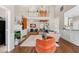 Bright living room with an open floor plan, hardwood floors, fireplace, and loft views at 107 Fox Den Dr., Murrells Inlet, SC 29576