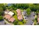 Aerial view of condo community featuring a swimming pool, parking, landscaping, and waterway at 1102 Indian Wells Ct. # 2, Garden City Beach, SC 29576