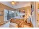 Comfortable bedroom with carpeting, natural light, and a queen size bed at 1102 Indian Wells Ct. # 2, Garden City Beach, SC 29576