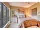 A bright bedroom with a queen sized bed, natural light, and plenty of storage at 1102 Indian Wells Ct. # 2, Garden City Beach, SC 29576