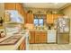 Kitchen with light colored cabinetry, countertops and appliances at 1102 Indian Wells Ct. # 2, Garden City Beach, SC 29576