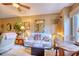 Living room with a dining nook and access to an outdoor balcony at 1102 Indian Wells Ct. # 2, Garden City Beach, SC 29576