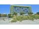 Beautiful exterior view of a modern resort building with scenic beach views at 1105 S Ocean Blvd. # 330, Myrtle Beach, SC 29577