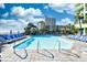 Inviting outdoor pool area with crystal-clear water, lounge chairs, and lush landscaping at 1105 S Ocean Blvd. # 330, Myrtle Beach, SC 29577