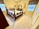 Cozy bedroom featuring a well-lit space with neutral carpet, windows, and a traditional-style bed at 112 Robin Dr., Georgetown, SC 29440