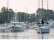 Scenic harbor view of multiple sailboats and motorboats anchored in calm water at 112 Robin Dr., Georgetown, SC 29440