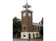 Historic brick clock tower featuring a white observation deck and clock faces on all four sides at 112 Robin Dr., Georgetown, SC 29440