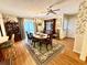 Formal dining room with a chandelier, floral wallpaper, and access to the outdoor space at 112 Robin Dr., Georgetown, SC 29440