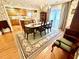 Elegant dining room adjacent to kitchen, featuring hardwood floors and natural lighting at 112 Robin Dr., Georgetown, SC 29440