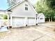 Attached three-car garage offering ample parking and storage space, complementing the home's exterior at 112 Robin Dr., Georgetown, SC 29440