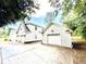 Detached three-car garage offering parking and storage space with an ADT security sign in view at 112 Robin Dr., Georgetown, SC 29440