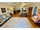 Spacious living room featuring hardwood floors, multiple seating areas, and lots of natural light at 112 Robin Dr., Georgetown, SC 29440
