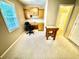 Functional home office with built-in desk and cabinets, bright natural light, and access to the bathroom at 112 Robin Dr., Georgetown, SC 29440