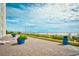 The boardwalk with plants and benches near the beach at 1200 S Ocean Blvd. # 20506, Myrtle Beach, SC 29577
