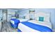 Bright bedroom with two beds, kitchenette, and beach-themed decor at 1200 S Ocean Blvd. # 20506, Myrtle Beach, SC 29577