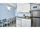 Bright kitchen features a range oven, stainless steel refrigerator and dining area at 1200 S Ocean Blvd. # 20506, Myrtle Beach, SC 29577