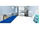 Modern kitchenette area featuring stove, microwave, mini fridge, and dining table at 1200 S Ocean Blvd. # 20506, Myrtle Beach, SC 29577