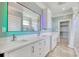 Bathroom with double sinks, large mirror with lights, quartz countertop, and walk-in shower at 125 Oak Bay Dr., Georgetown, SC 29440